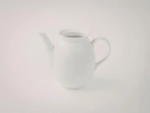 White ceramic teapot with handle and spout Photos
