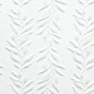 White ceramic tile with leaves pattern for wall decoration. Concrete stone Stock Photos