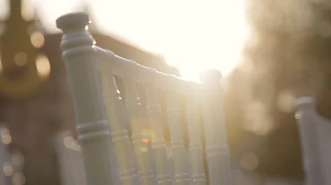 White chair in sun rays close up Stock Footage 64917553