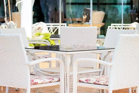 White Chairs And Table In Restaurant Stock Photos
