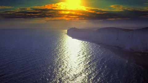 White chalk cliffs and Beachy Head Lighthouse. Eastbourne, East Sussex, England Stock Footage 72789954