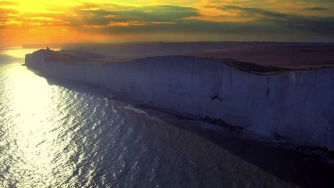 White chalk cliffs and Beachy Head Lighthouse. Eastbourne, East Sussex, England Stock Footage 73118376