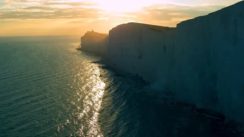 White chalk cliffs and Beachy Head Lighthouse. Eastbourne, East Sussex, England Stock Footage 88542706