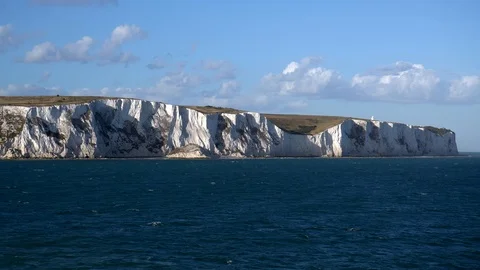 White chalk cliffs and Beachy Head Lighthouse. Eastbourne, East Sussex, England Stock Footage 88822793