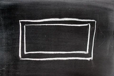 White chalk drawing in blank square shape on blackboard background Foto stock