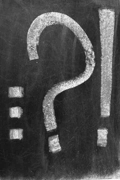 White chalk drawing of question mark, exclamation mark and three point Foto stock