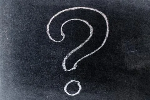 White chalk drawing in questionmark shape on black board background Stock Photos