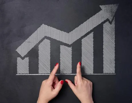 White chalk drawn graph columns and up arrow, indicator growth concept Stock Photos
