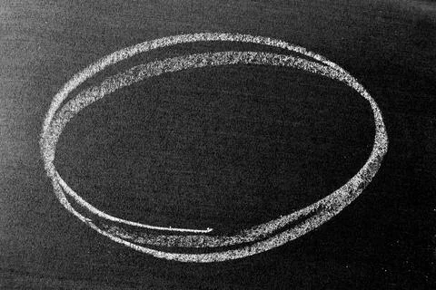 White chalk hand drawing as circle shape on blackboard or chalkboard backgrou Stock Photos