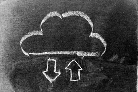 White chalk hand drawing in cloud with up and down arrow icon shape on black  Stock Photos