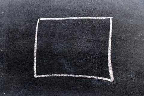 White chalk hand drawing in square or banner shape on black board background Foto stock
