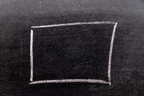 White chalk hand drawing in square or banner shape on black board background 库存照片
