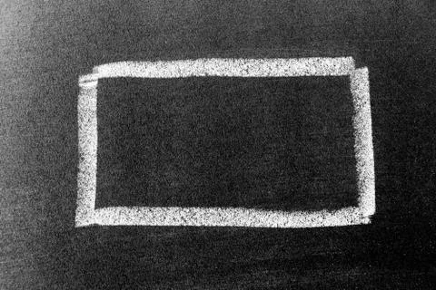 White chalk hand drawing in square or banner shape on black board background Foto stock