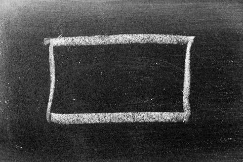 White chalk hand drawing in square or banner shape on black board background Foto stock