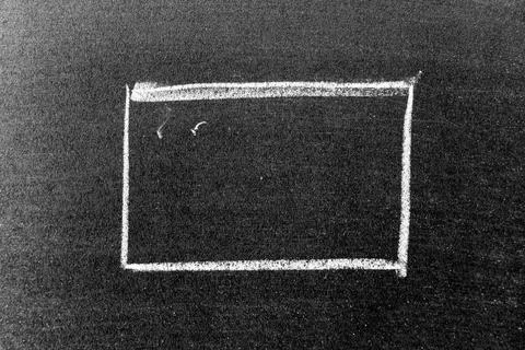 White chalk hand drawing in square or banner shape on black board background Foto stock