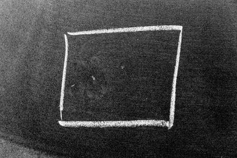 White chalk hand drawing in square or banner shape on black board background Foto stock