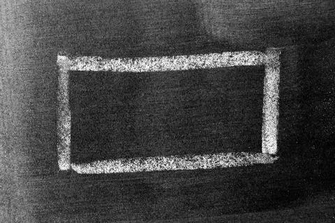 White chalk hand drawing in square or banner shape on black board background Foto stock