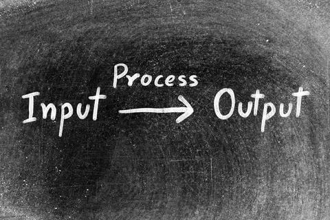 White chalk hand writing in flow of input and output with process on blackboa Stock Photos