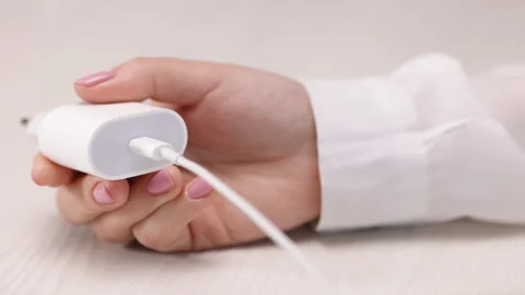White charging with type-c socket and cable on a white background. A plug with a Stock Footage 194666287