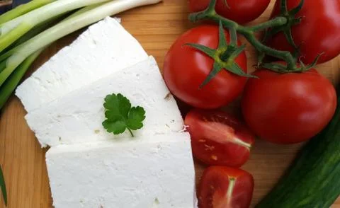 White cheese with vegetables Stock Photos