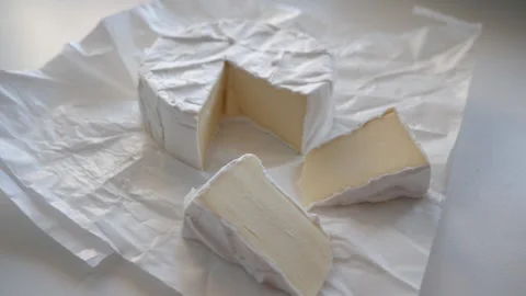 White cheese on white paper Video stock 153436287