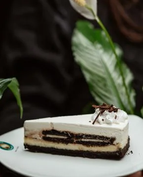White cheesecake with chocolade on the table Stock Photos