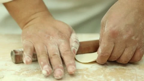 White chef rolls dumpling skin (1) Stock Footage 202153392