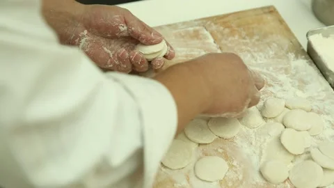 White chef rolls dumpling skin (4) Stock Footage 202153441
