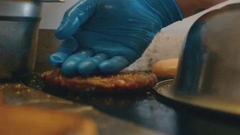 White chef stroking with love his meat for burgers Stock Footage 104649703