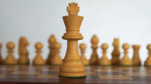 White chess figures on background and king on foreground 库存影片 128832168