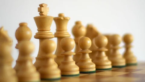 White chess figures on a light background with focus shift Stock Footage 127835721