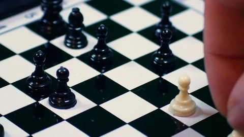 White chess pawn is surrounded by black pawns, ideal footage to represent Stock Footage 101590076