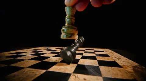 A white chess piece king overthrows the black king on a chess board 스톡 동영상 58412793