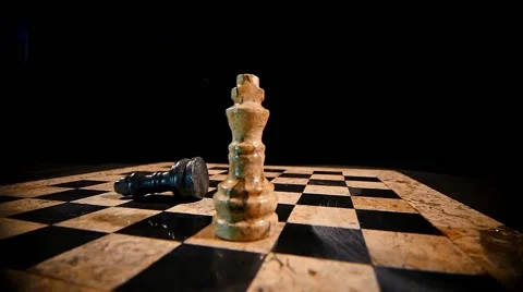 A white chess piece king overthrows the black king on a chess board 스톡 동영상 58415154