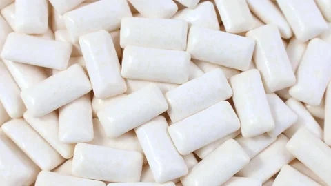 White chewing gum pads texture circle rotation close up top view Stock Footage 277684853