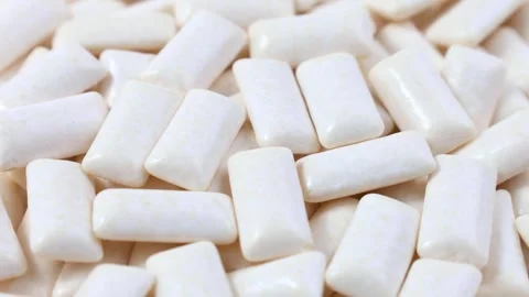 White chewing gum pads texture circle rotation close up Stock Footage 278401723