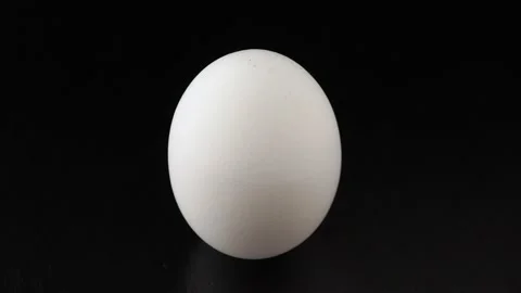 White chicken egg close up on black background 動画素材 140614762