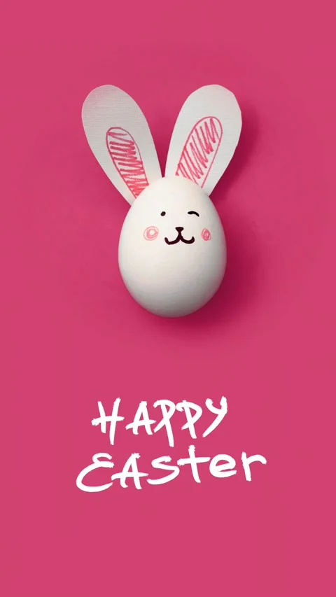 White chicken egg with cute bunny face, paper rabbit ears Stock Footage 300652952