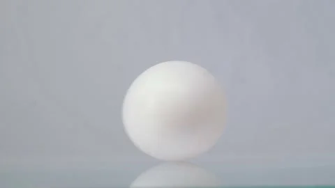 White chicken egg spinning on a white background or white table. Nutrition Video stock 147407309