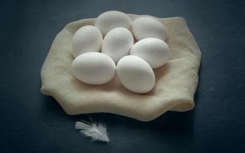 White chicken eggs on a dark background, healthy food Stock Photos