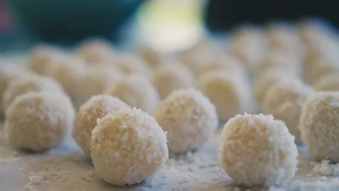 White chocolate balls covered in ground coconut Stock Footage 274630307
