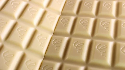 White chocolate bar bars rotating texture pattern closeup footage Video stock 97232400