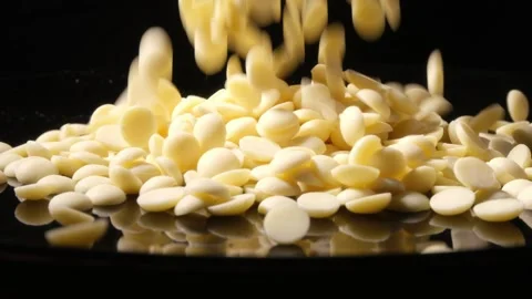 White Chocolate Chips Falling 4K High Speed Stock Footage 331298007