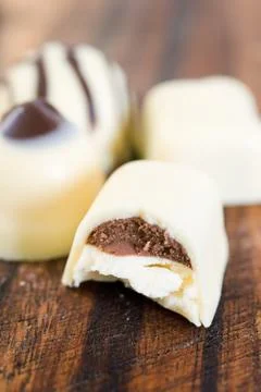 A white chocolate with a missing bite Foto stock