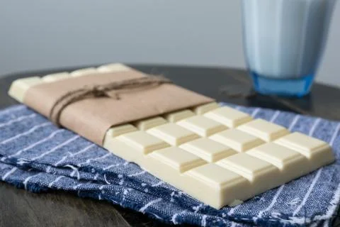 White chocolate tablet on rustic background Foto stock