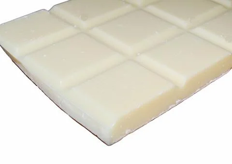 White chocolate on a white background Stock Photos