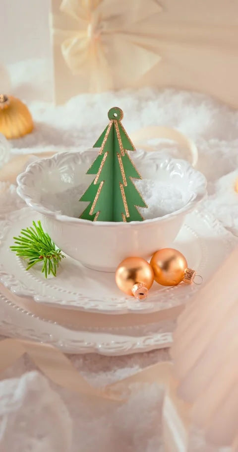 White Christmas table setting featuring baubles, decor, and snow. Stock Footage 346556620