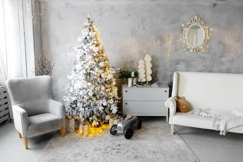 White Christmas tree decorating cozy living room interior Stock Photos