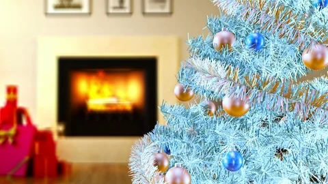 White Christmas tree next to burning fireplace and gift boxes at living room Video stock 100200863