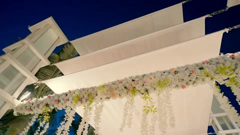 White chuppa with flowers view from below Video stock 219880030
